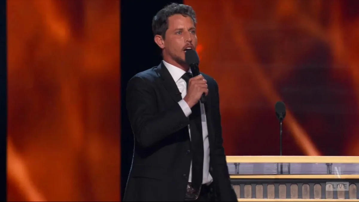 A comedian at the mic during the Tom Brady roast