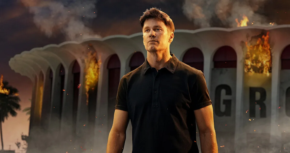 Tom Brady before a burning Kia Forum, roast key art