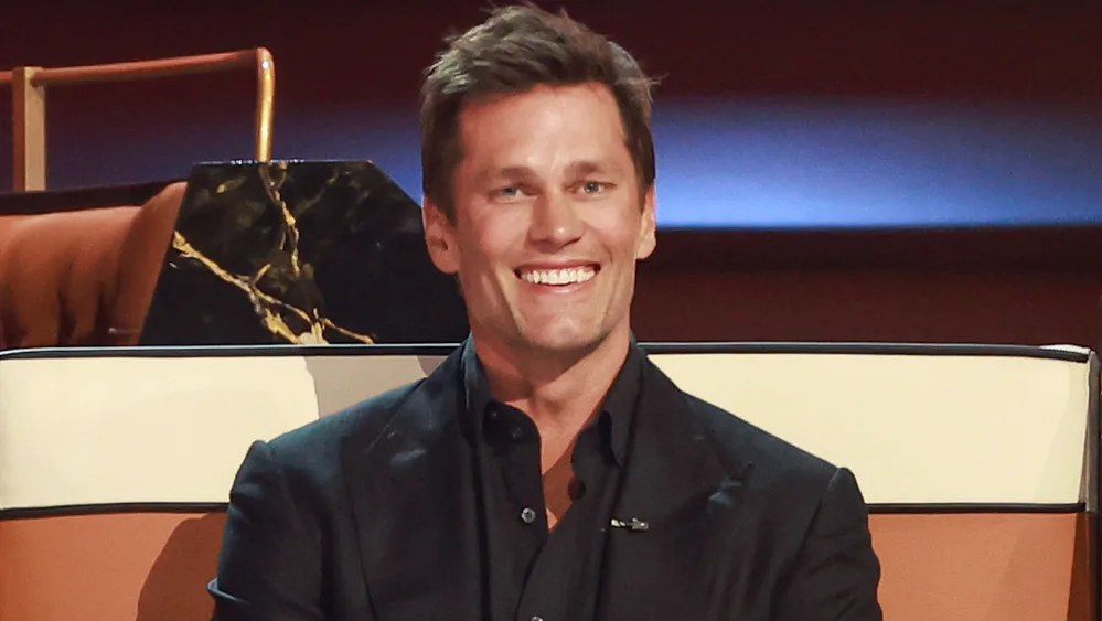 Tom Brady laughing on the dais