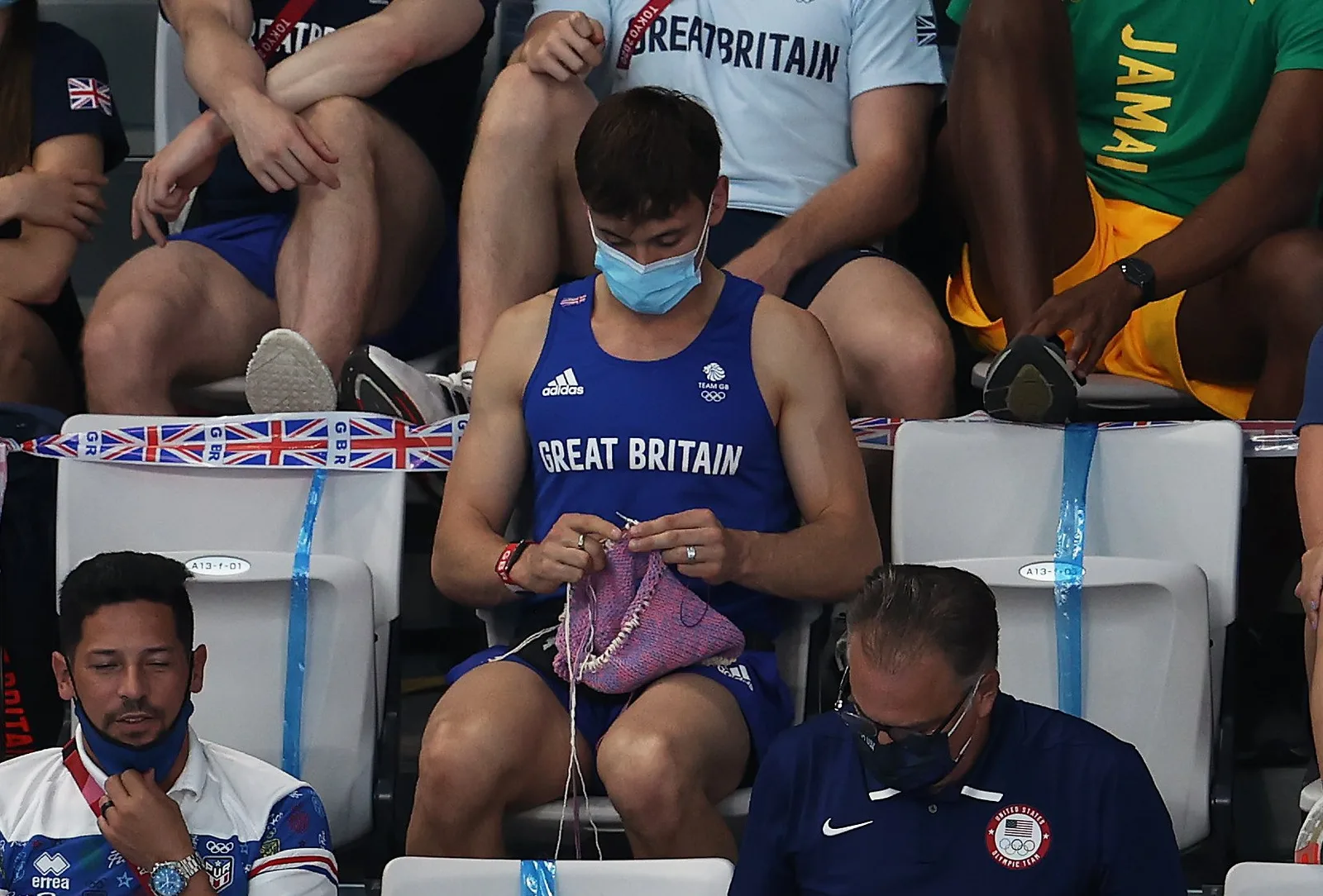 Tom Daley knitting in the stands at the Tokyo Olympics, as posted by @Olympics
