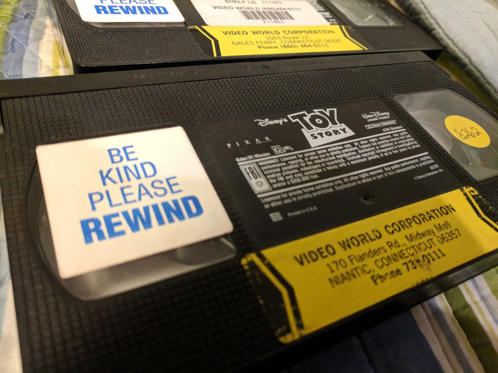 A Toy Story VHS cassette with a Be Kind Please Rewind sticker