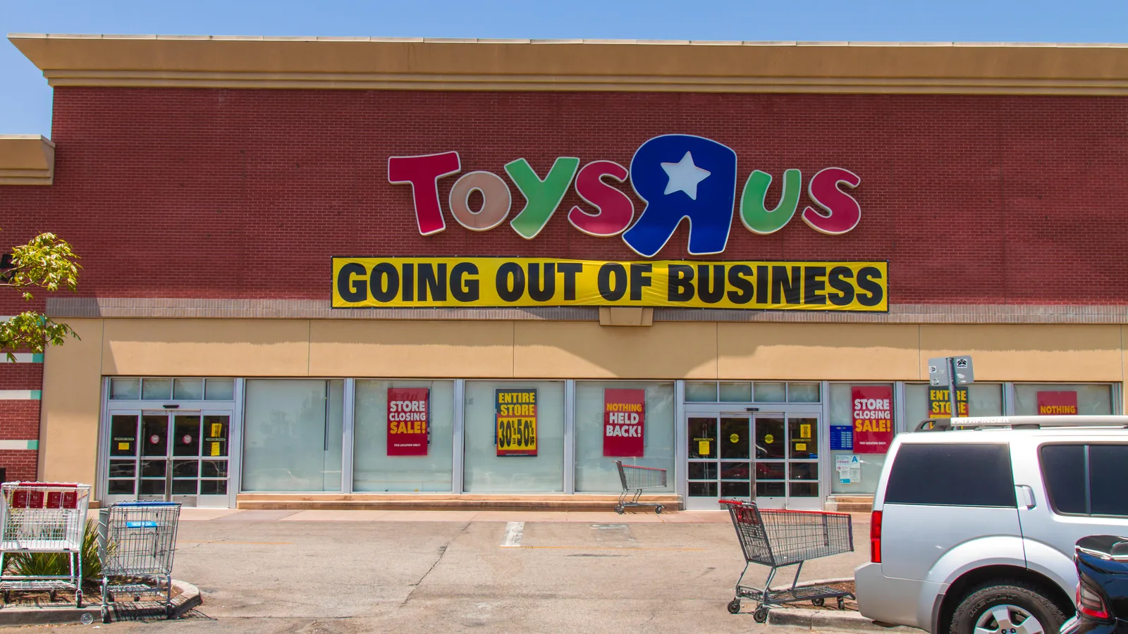 A Toys "R" Us store with a Going Out of Business banner