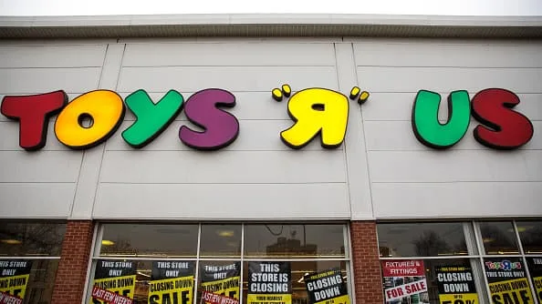 Toys "R" Us sign above closing-sale windows