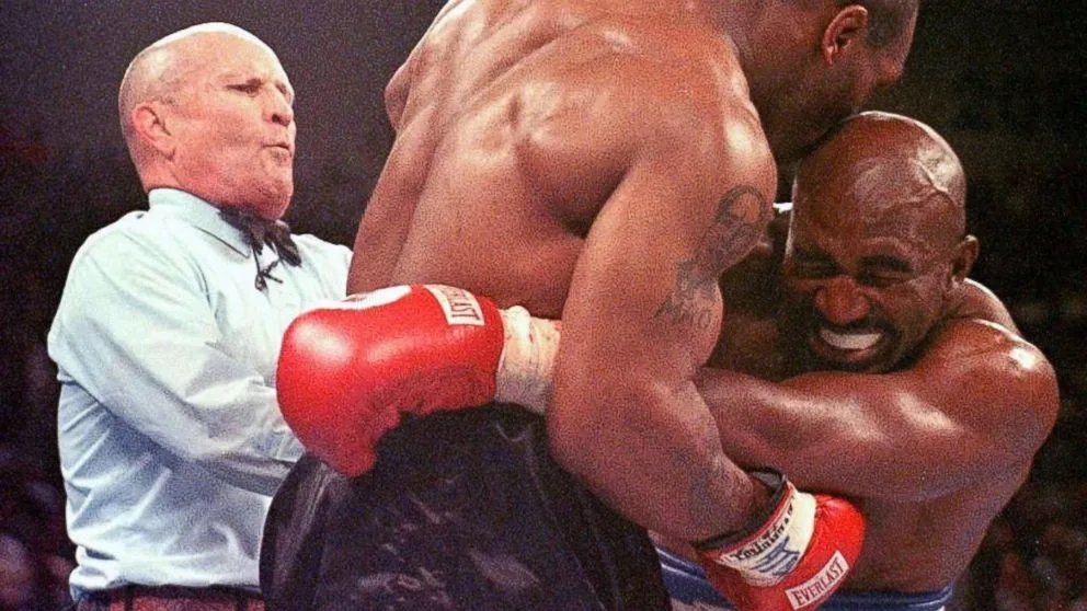 Referee Mills Lane separates Tyson and Holyfield in the clinch