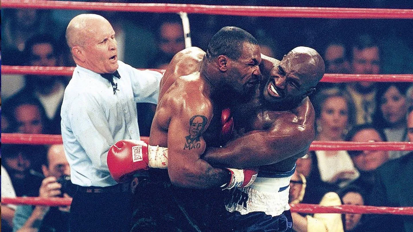Tyson and Holyfield in a clinch moments before the bite