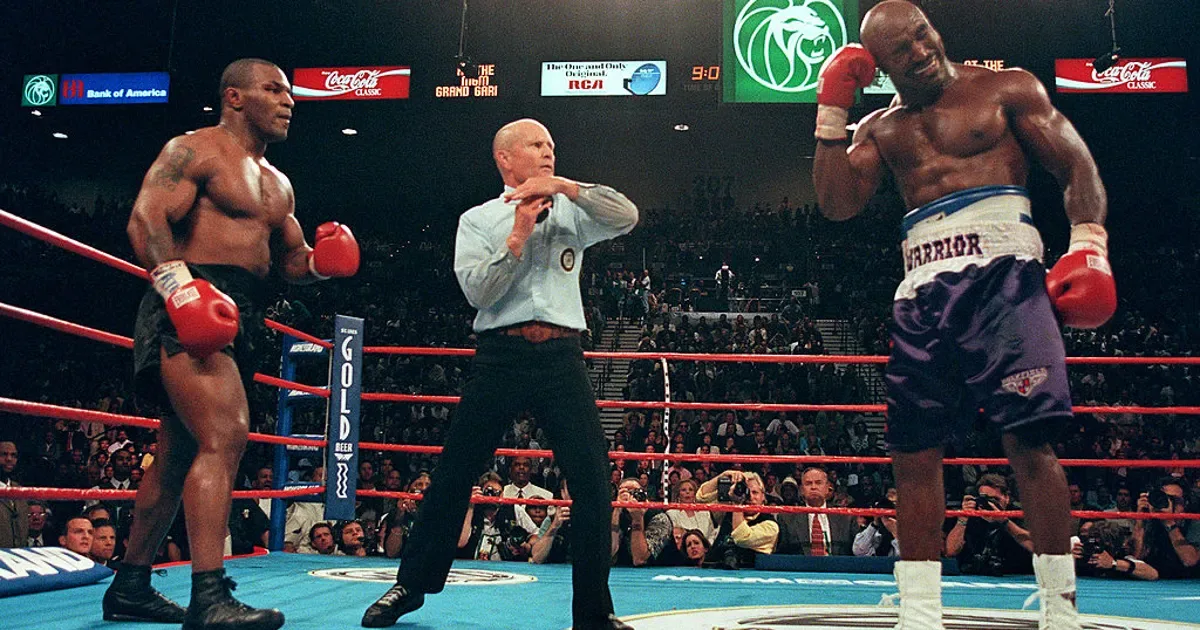 Mills Lane between Tyson and Holyfield in the ring
