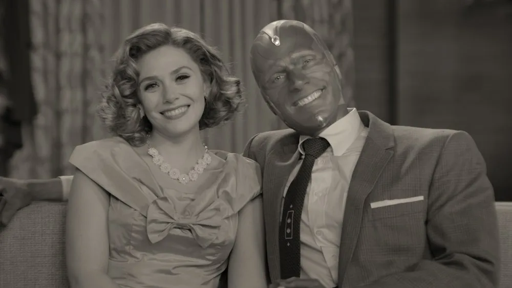 Wanda and Vision on a black-and-white sitcom set