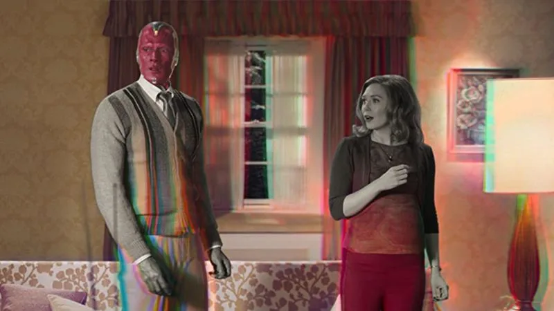 Vision and Wanda in a 1980s-style living room