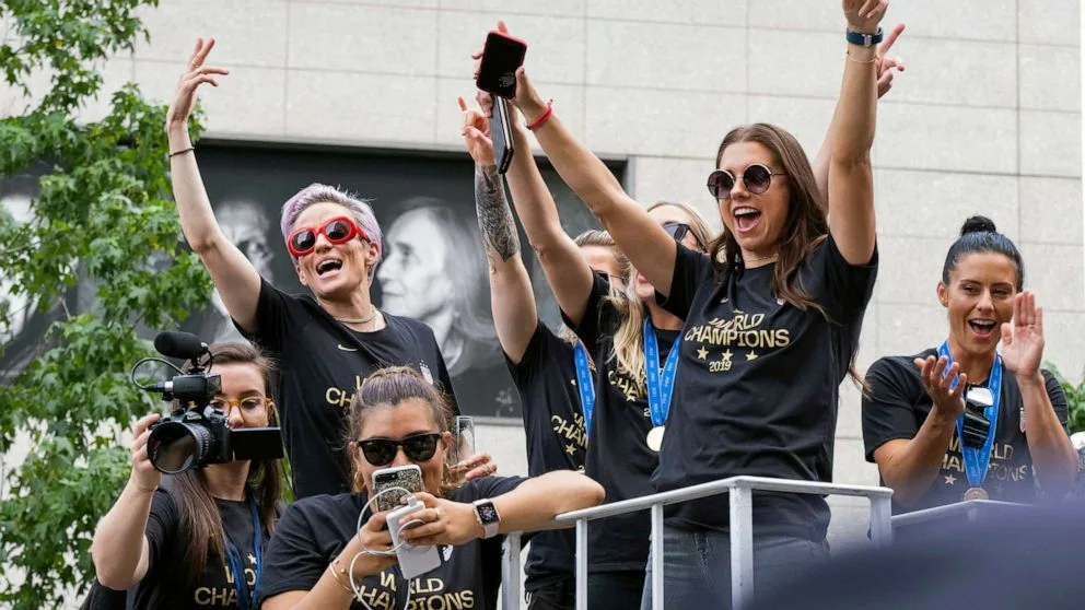 US women's soccer World Cup ticker tape parade marked by calls for equal pay