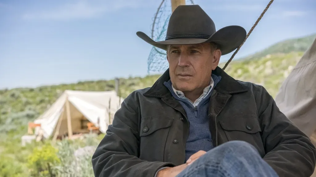 Kevin Costner as John Dutton by a ranch tent