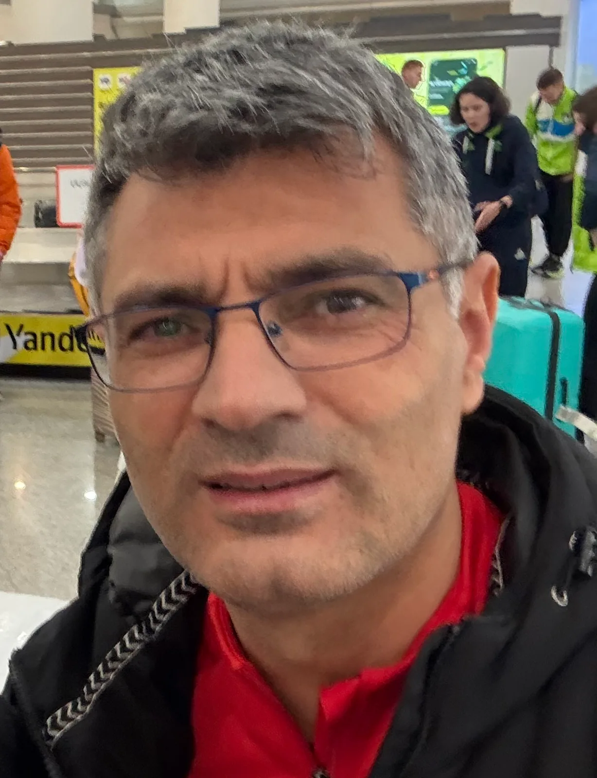 Dikeç at Yerevan airport in February 2026; this is not a Paris competition photograph.