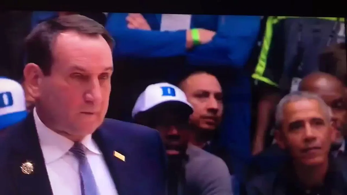 Barack Obama courtside reacting as the shoe broke